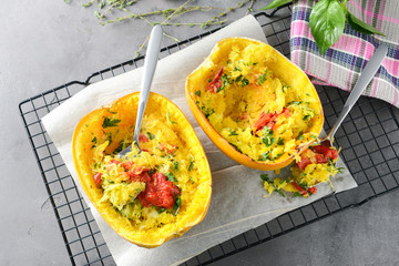 Halves of stuffed spaghetti squash on table