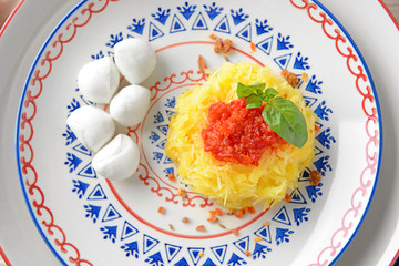 Tasty spaghetti squash on plate, close up