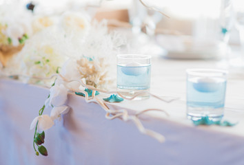 festive wedding ceremony on a background a sea. Registration of holiday is in violet and blue colors