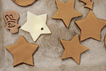 Christmas cookies on a wooden plate on a wooden background