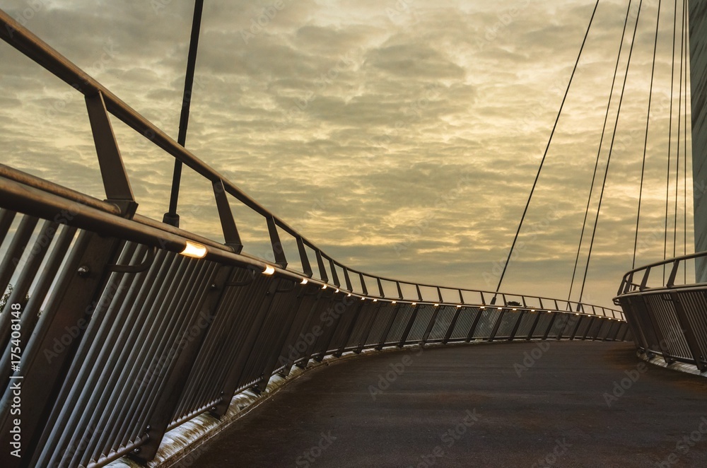 Wall mural a cable-stayed bridge at sunset over the m20 motoroway, ashford, kent, england