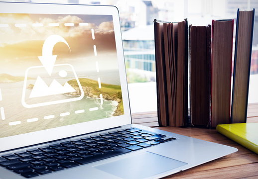 Laptop Mockup on Wooden Desk with Books