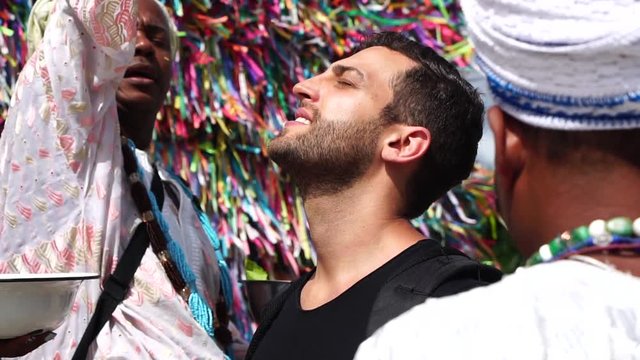 Candomble group blessing a tourist in Salvador, Bahia, Brazil