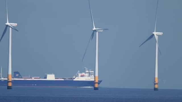offshore wind turbines producing clean renewable energy in the north sea, kent, uk