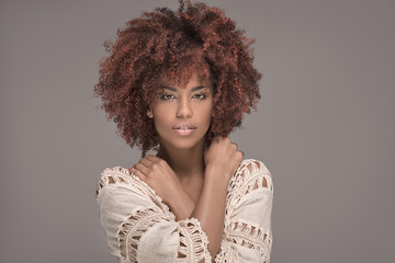 Beautiful woman with afro hairstyle posing. - obrazy, fototapety, plakaty