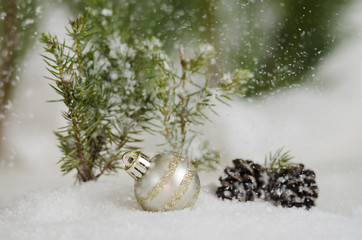 Silver ornament in the snow fall