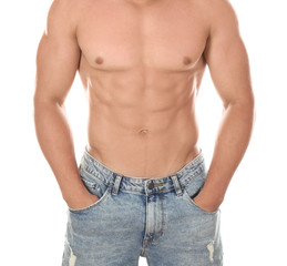 Naklejka premium Sporty young man on white background