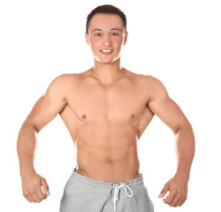 Fototapeta premium Sporty young man on white background