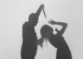 Silhouette of man trying to kill his wife on white background. Domestic violence concept