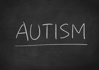 Obraz premium autism concept word on a blackboard background