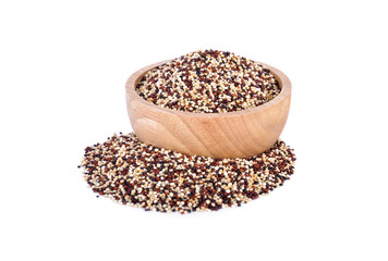 dry tricolor quinoa in wooden bowl and on white background