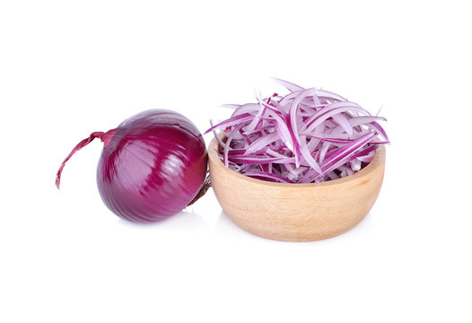 sliced shallot or red onion in wooden bowl and on white background