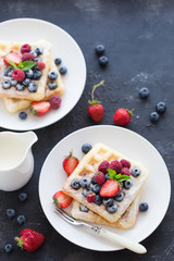Plate of belgian waffles with fresh berries