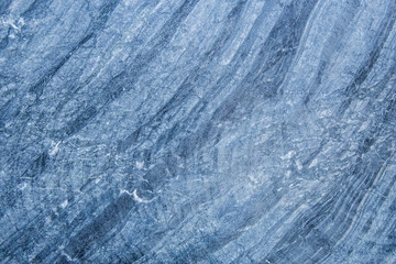 The pattern and surface of the blue, white and black marble walls for the background and tile design.