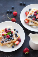 Plate of belgian waffles with fresh berries