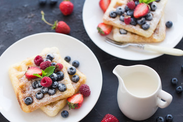 Plate of belgian waffles with fresh berries