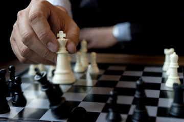 Businessman play chess use King - Chess Piece white to crash overthrow
