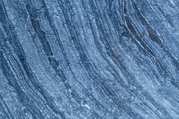 The pattern and surface of the blue, white and black marble walls for the background and tile design.