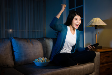 happy beautiful woman raised hand celebrating