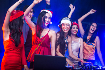 Fototapeta premium Group of young Asian Women Dancing Together in Nightcub. Woman Dancing with Attractives Smiling. People with Party Concept.