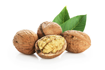 Walnuts with leaves isolated on white background.