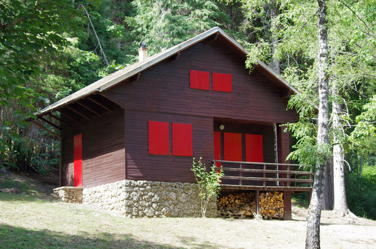 Mountain lodge with red windows