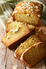 Delicious sweet zucchini bread with almonds close-up. vertical