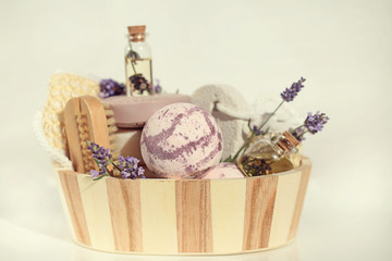 Bath set with lavender. spa set. Lilac bomb for bath, bath brush, pumice, lavender oil, lavender flowers in a wooden bowl 