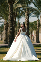 Woman in white wedding dress, back view.