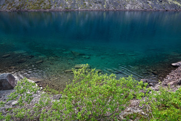 Naklejka na ściany i meble Mountain lake with clear water. Kola Peninsula , Khibiny . Russia.