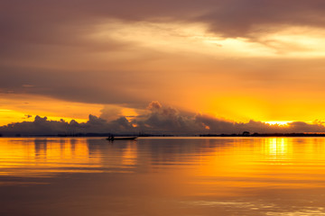 Fototapeta na wymiar Beautiful lake after sunset with clouds.