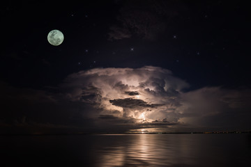 Fototapeta na wymiar Full moon in the dark sky
