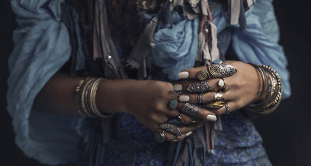 Fototapeta na wymiar gypsy style young woman wearing tribal jewellery close up