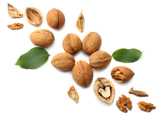 Green walnuts with leaves isolated on a white background Top view