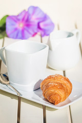 Delicious croissants with cup of coffee