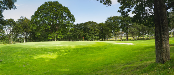Obraz premium Golf Course where the turf is beautiful and putting green in Hokkaido, Japan. Golf is a sport to play on the turf