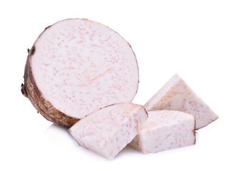 half and slice of taro root isolated on white background