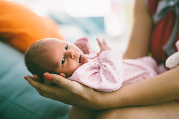 Mother holding beautiful little newborn