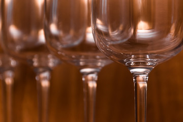 Catering, party concept: wine glasses on a wooden background. Selective focus.