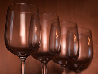 Catering, party concept: wine glasses on a wooden background. Selective focus.