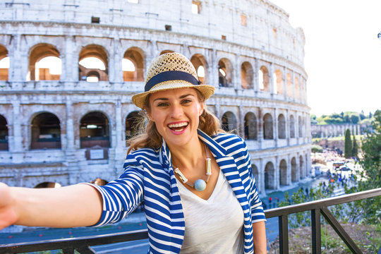 happy elegant traveller woman in Rome, Italy taking selfie