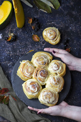 fresh pumpkin cinnabon buns with cinnamon and frosting