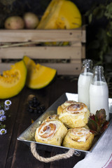 fresh pumpkin cinnabon buns with cinnamon and frosting