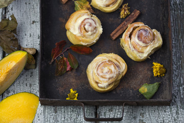 fresh pumpkin cinnabon buns with cinnamon and frosting