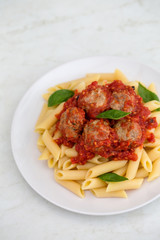 Pasta penne on a white plate