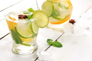 Jug with Lime and Orange Fruit Water with ice