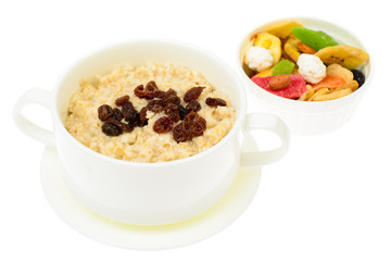 Health and Fitness food. Oatmeal porridge with berries and dried fruits