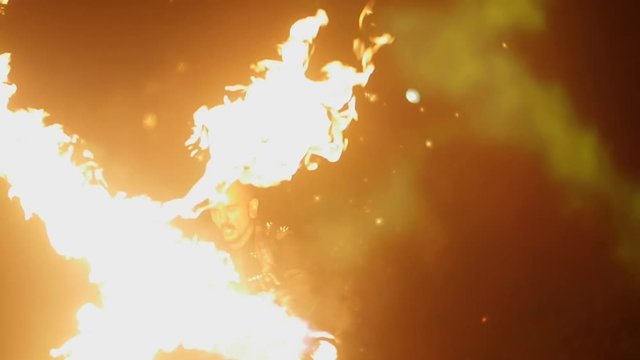 man with a flamethrower on the background of a salute