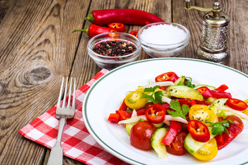 Spicy salad of fresh vegetables with chili