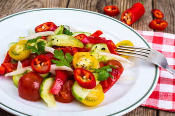 Spicy salad of fresh vegetables with chili